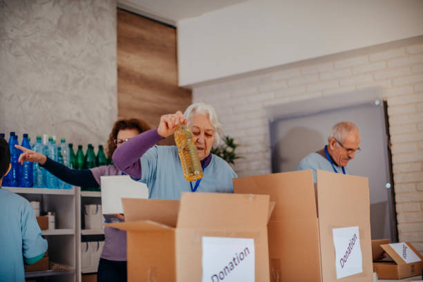 istock Multi-generation family preparing food donation 1370340173