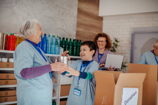 istock Multi-generation family preparing food donation 1370341279