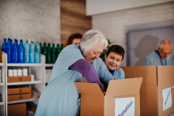 istock Multi-generation family preparing food donation 1370341448