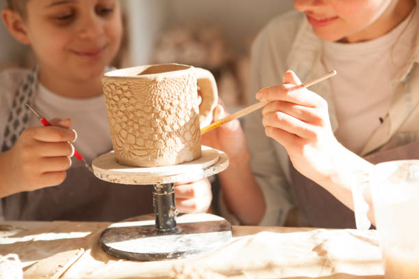 istock Mother and son enjoying making pottery together 1370342237