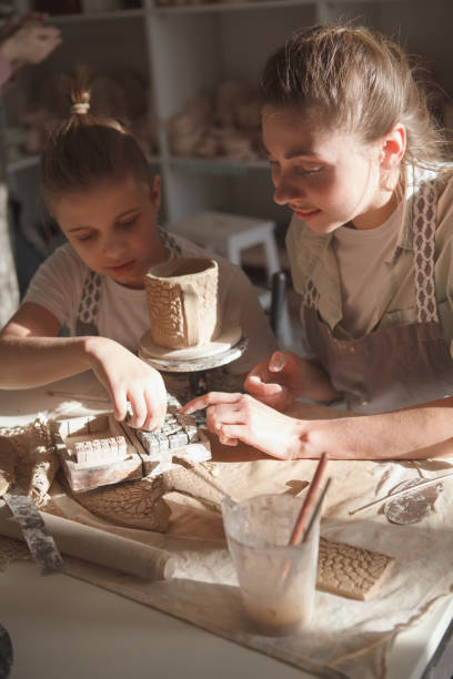 istock Mother and son enjoying making pottery together 1370342367