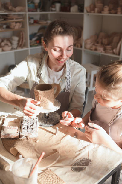 istock Mother and son enjoying making pottery together 1370342997