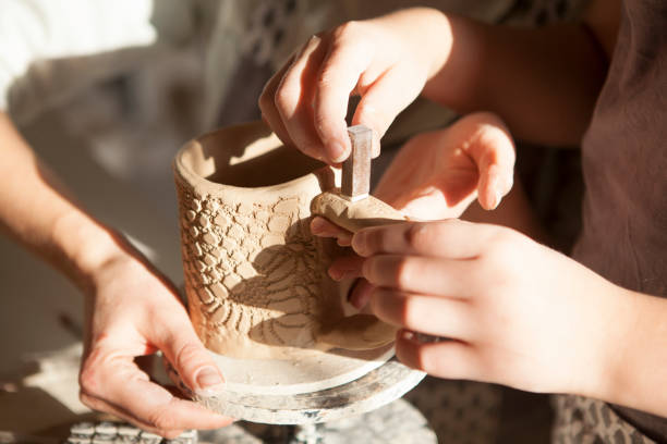 istock Mother and son enjoying making pottery together 1370343081