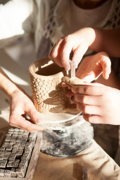 istock Mother and son enjoying making pottery together 1370343098