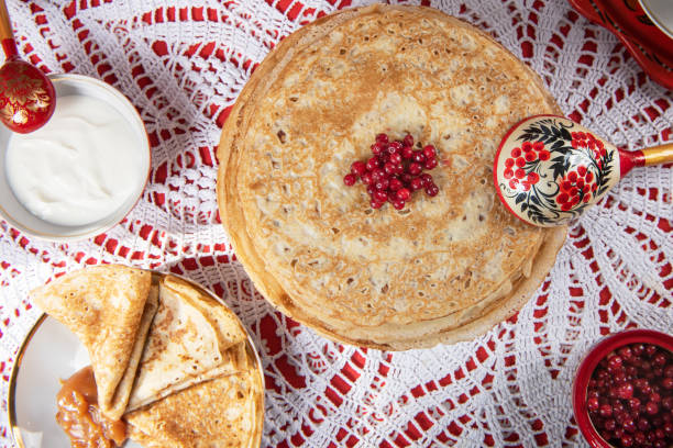 istock Russian pancake blini with berries and sour cream 1370343695