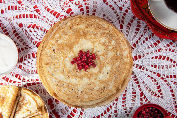 istock Russian pancake blini with berries and sour cream 1370343721