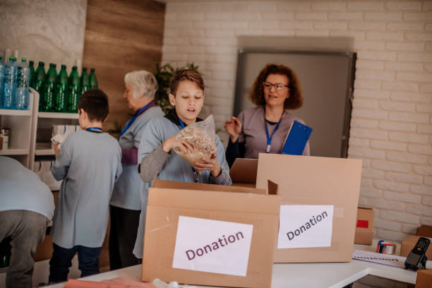 istock Multi-generation family packing food donation 1370343849
