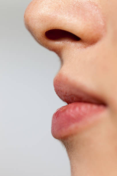 istock Close-up of woman's mouth 1370345537