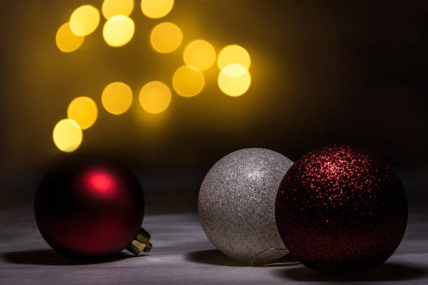 istock White and red christmas ball with defocused lights background 1370346474