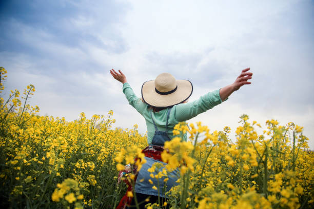 istock Happy woman in nature 1370347833