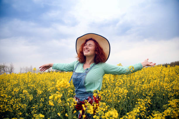 istock Happy woman in nature 1370347859