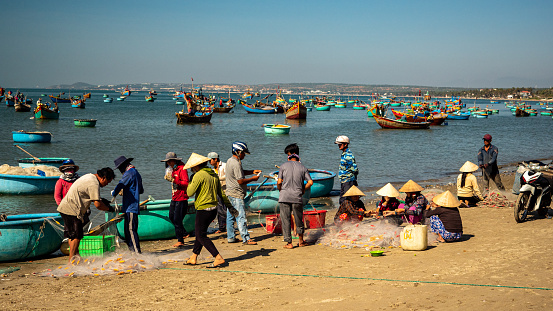 People working in Mui Ne Fishing Village, Vietnam, December 11, 2019.