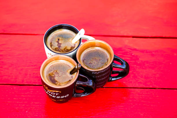 Cup of fresh made coffee on wooden background
