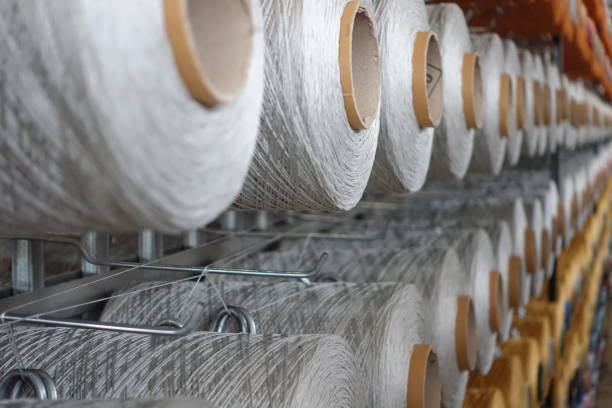 TEXTILE, SYNTHETIC YARN TYPES, POLYESTER YARN TYPES. POLYESTER YARN COLORS AND TYPES, WEAVING YARNS USED FOR CARPET PRODUCTION, CARPET PRODUCTION MACHINE. carpet factory stock pictures, royalty-free photos & images