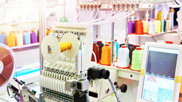 istock Industrial embroidery machines in sewing workshop 1370357671