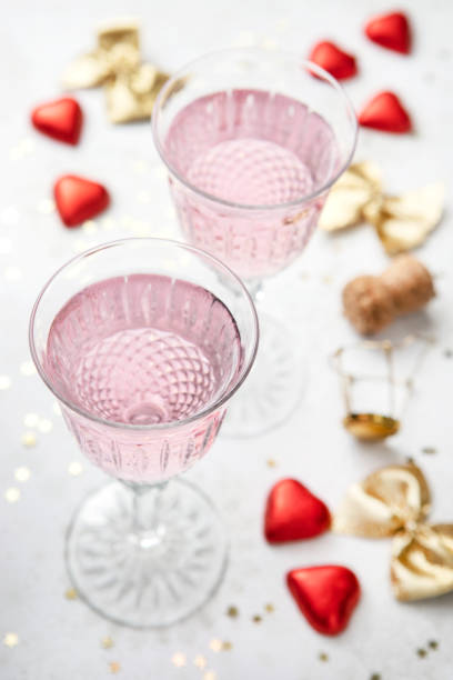 istock Two crystal champagne glasses for romantic party 1370358417