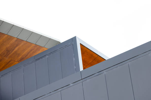 Closeup detail of modern building, top part, white background with copy space stock photo