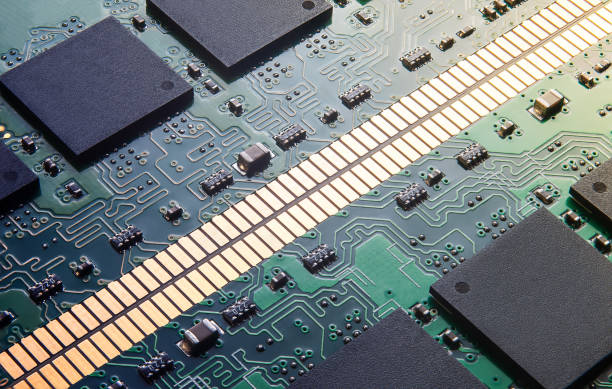 istock Closeup of Printed Circuit Board with  integrated circuits and many other passive electrical components. 1370366888