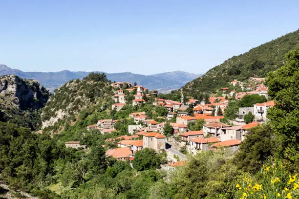 Photo of View of the village Stemnitsa in the mountains on a sunny day (district Arcadia, Peloponnese, Greece).