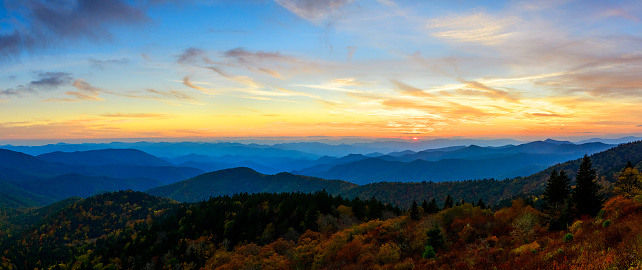 This sunset image is a golden, blue and orange homage to the beauty of the Blue Ridge Parkway.