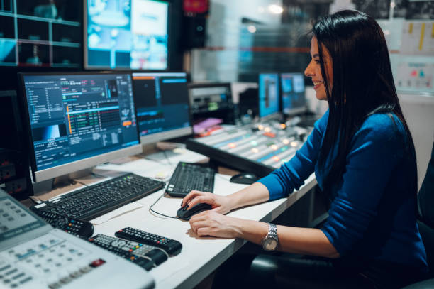 istock Middle aged woman using equipment in control room on a tv station 1370373178
