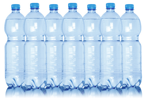 Water bottles in a row collection isolated on a white background