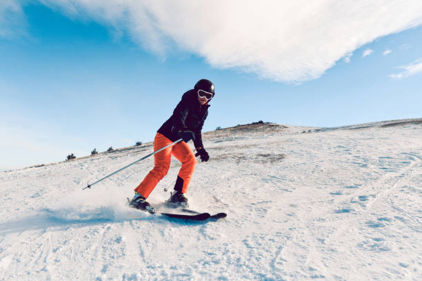istock Focused Female Speeding While Skiing On Mountain 1370377587
