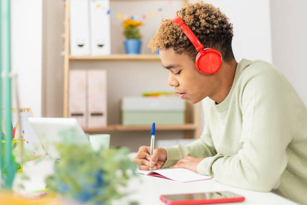 istock Young student man studying online with digital tablet in his studio room 1370382363