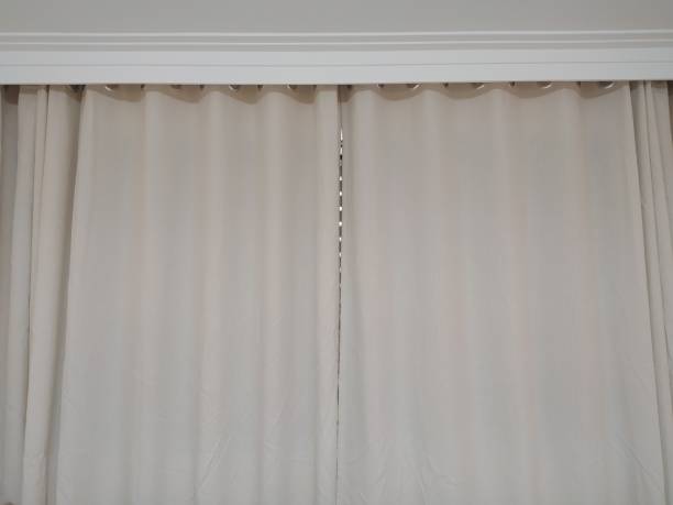 istock Closed curtains of an apartment window 1370390462