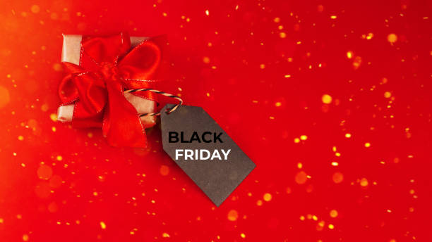 istock Gift box on a red background.Minimalism style. Creative design. Copy space. Banner.Sale, discount, shopaholism concept. Consumer society trend.Black Friday Super Sale.Black Friday shopping sale concept with red ticket Sale tag close up. 1370390596