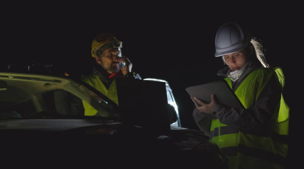 istock High voltage engineers working on the field at night. Sustainable energy. 1370390651