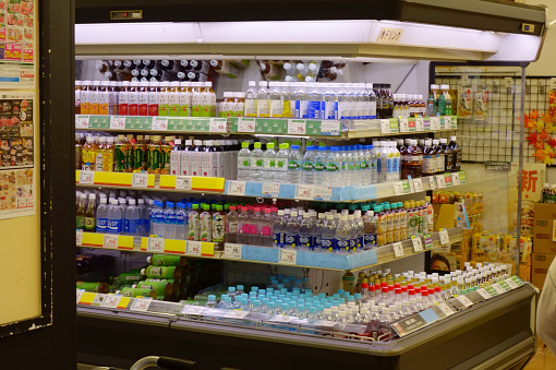 Various PET bottles lined up in the drink section of the supermarket
