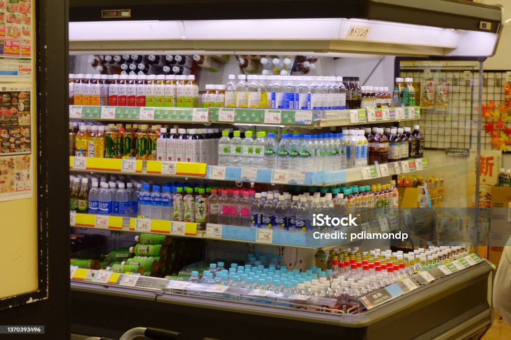 Drink counter, various PET bottles Various PET bottles lined up in the drink section of the supermarket Supermarket Stock Photo