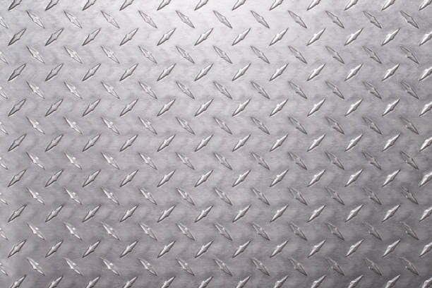 istock stainless steel texture with diamond print. shiny metal background 1370395493