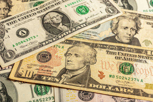 istock Close-up of multiple American dollar banknotes. 1370399220