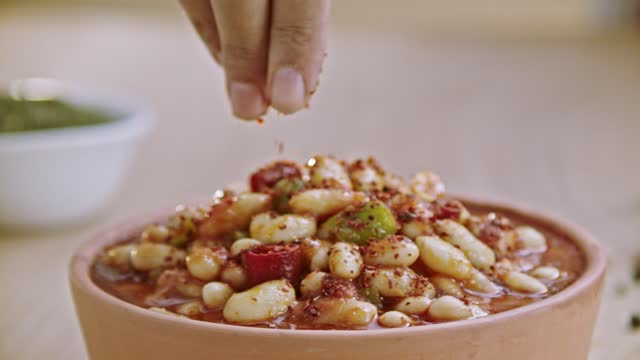 Red pepper powder is thrown on the beans cooked in Turkish style.