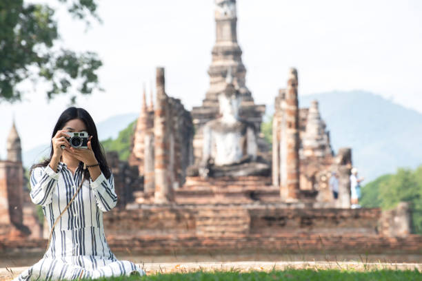 istock Asian tourists is visiting at Sukhothai in Thailand. 1370406057
