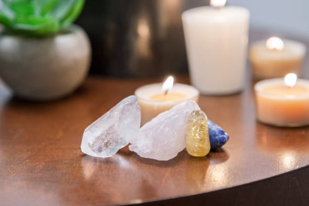 istock Healing crystals in bedroom on table with candles 1370406915