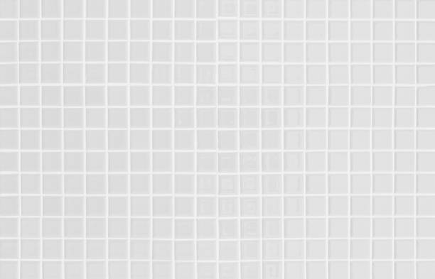 istock White or gray ceramic wall and floor tiles abstract background. Design geometric mosaic texture decoration of the bedroom. Simple seamless pattern for backdrop hospital wall, canteen and grid paper. 1370406925