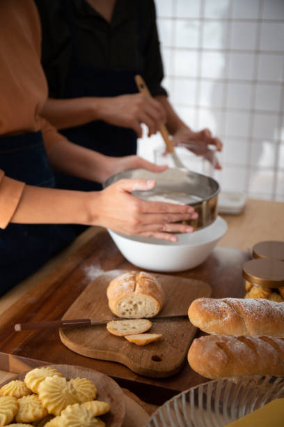 istock Asain Woman cooking and baking cake in kitchen alone happily 1370406940