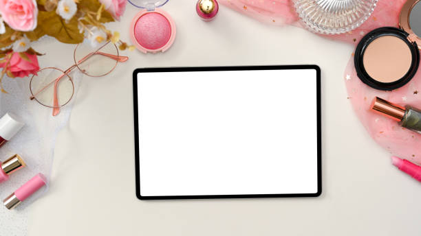 istock Beautiful stylish pink beauty blogger workspace with tablet mockup. 1370409807