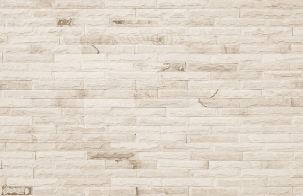 sfondo vuoto di ampia trama del muro di mattoni color crema. beige vecchio marrone mattoni muro cemento o pietra strutturato, carta da parati calcarea pavimentazione astratta / griglia roccia interna irregolare. sfondo di design per l'arredamento della cas - retro revival pattern masonry old foto e immagini stock