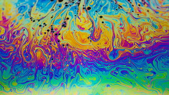 Rainbow colors created by soap, bubble,colors mix from oil makes can use background