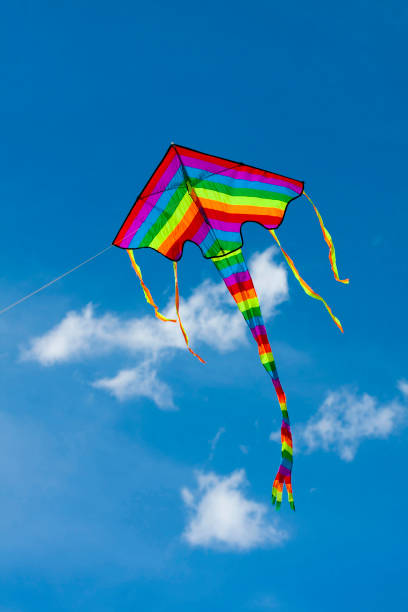 istock A colorful kite flies into the blue sky. 1370417619