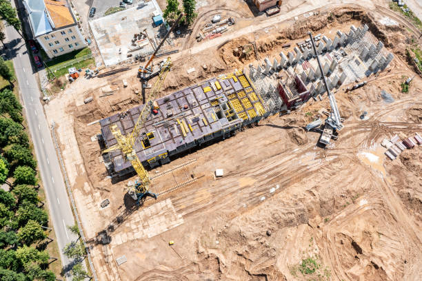 istock construction site in residential area. modern high-rise apartment building under construction. aerial overhead view. 1370418877