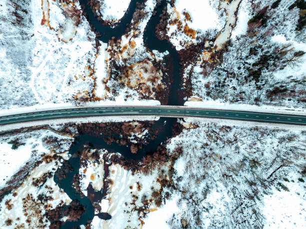 istock Aerial view of small river in Early spring. Snow melting during thaw 1370420714