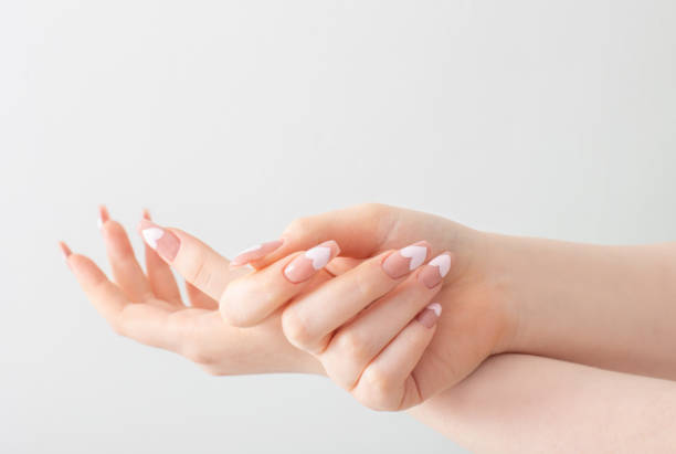 istock female hands with beautiful long nails with  manicure with  heart pattern 1370422209