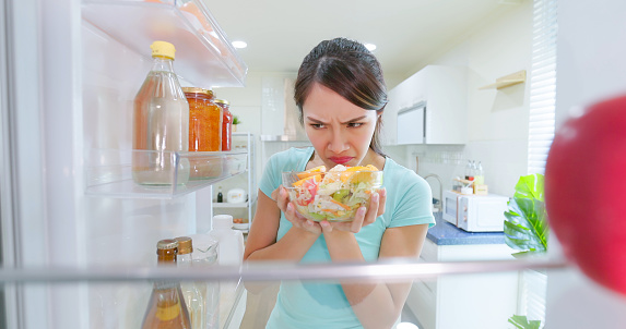 woman open refrigerator