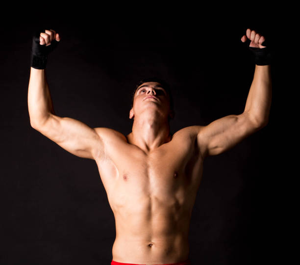 istock Portrait of a boxer posing in the studio with gloves. 1370428862