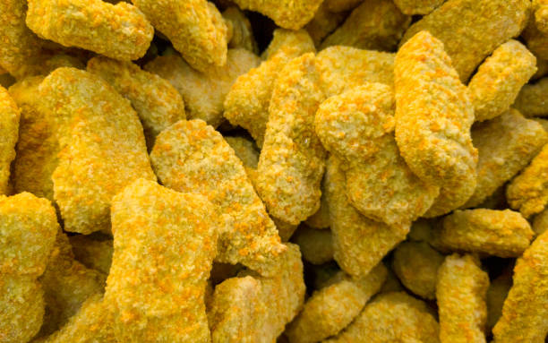 stack of frozen chicken nuggets in the freezer
